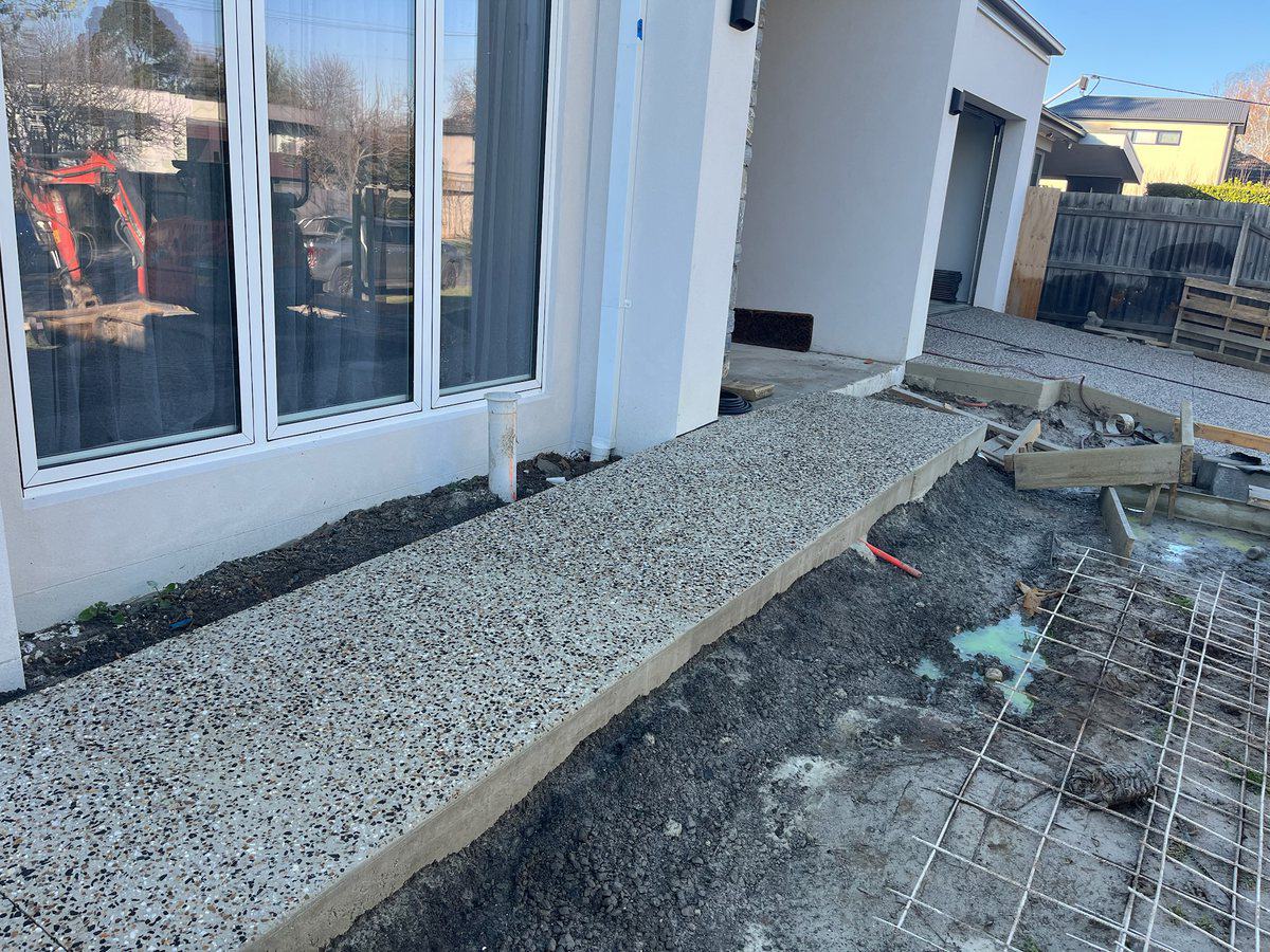 Compacted base and steel mesh laid out before a pour