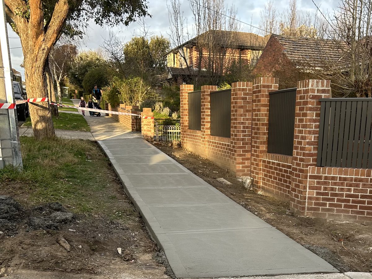 Reinstated council footpath poured along the street frontage of a property