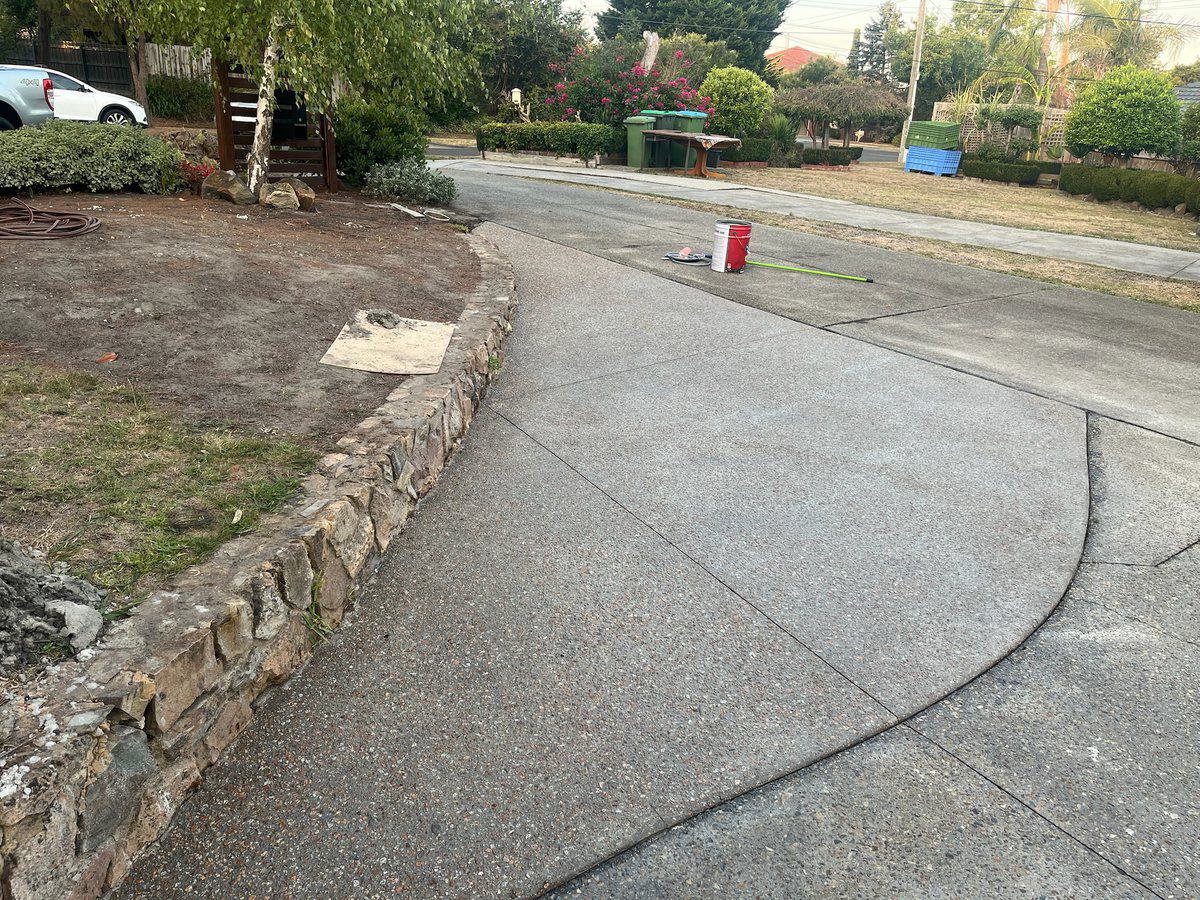 Driveway running out across the crossover to meet the street
