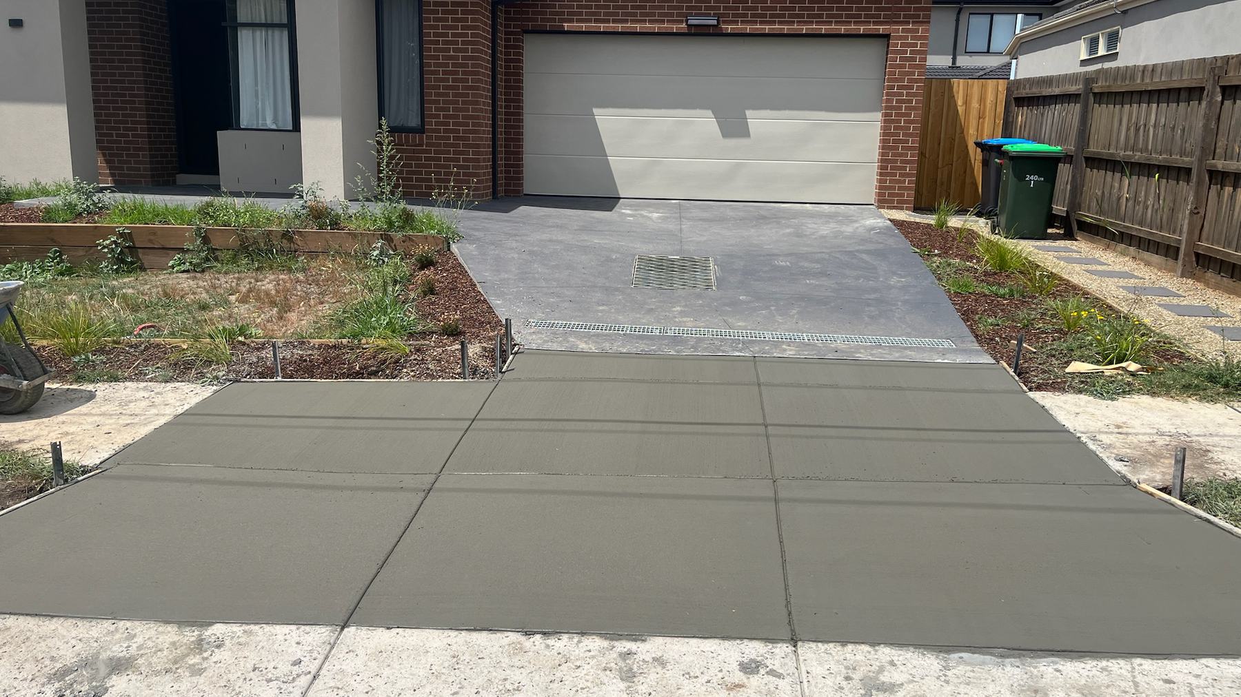 New driveway and crossover running out to the kerb at a recently completed build