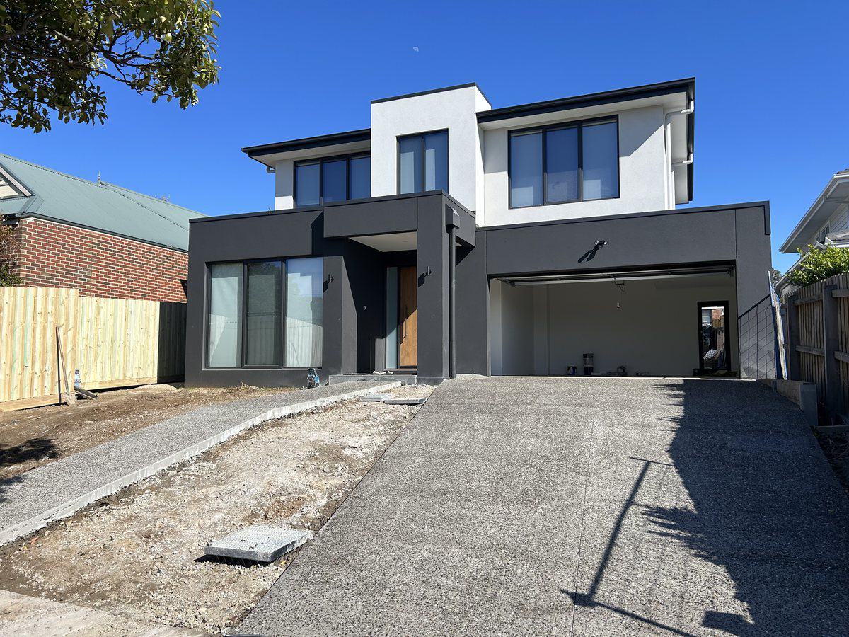Exposed aggregate driveway finished at a new dual-occupancy build in Melbourne's east